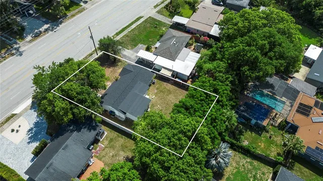 an aerial view of house with yard