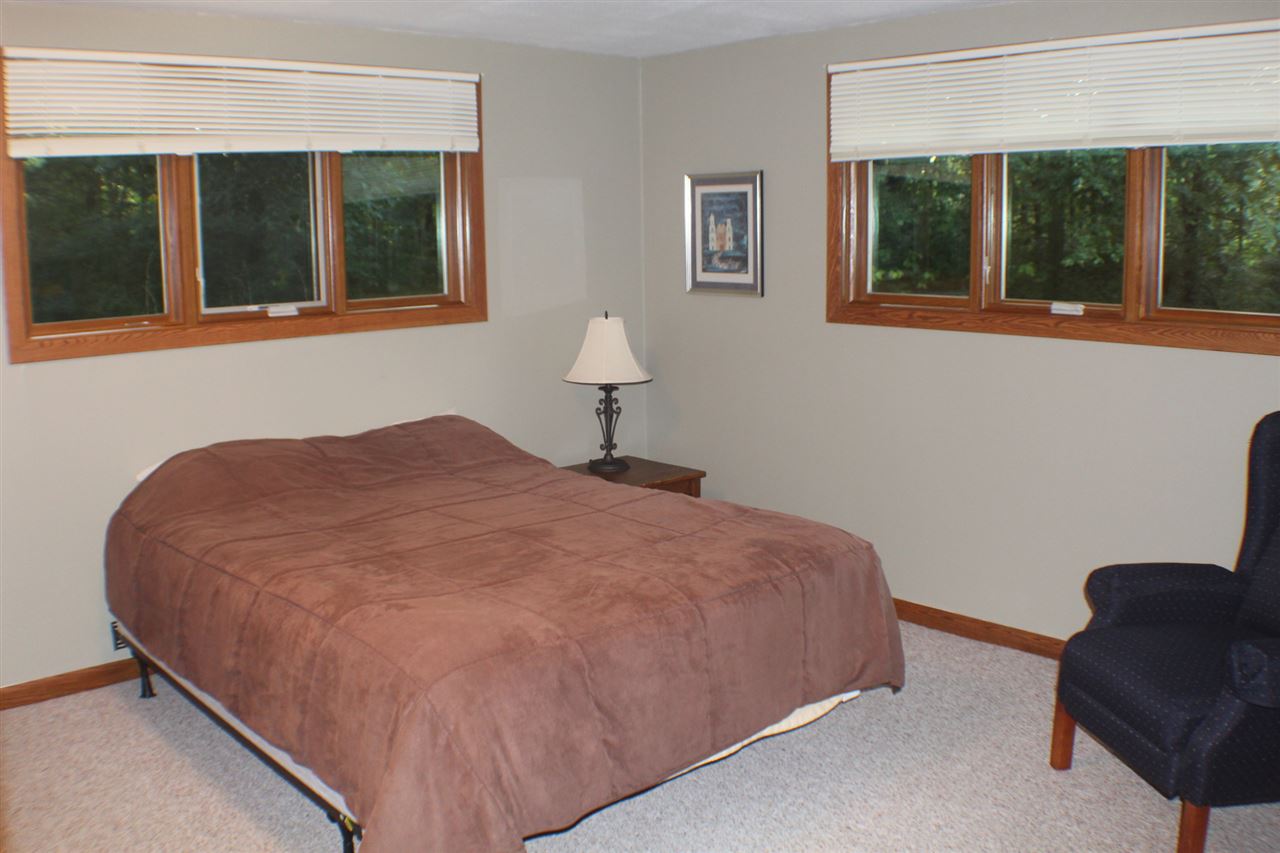 840 Spring Ridge Court Belvidere, IL 61008 - Photo 18 of 25 a bedroom with a bed and a window
