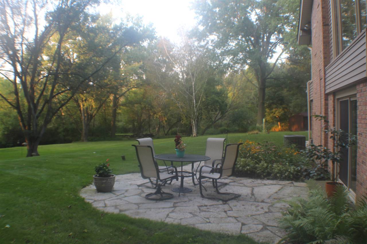 840 Spring Ridge Court Belvidere, IL 61008 - Photo 25 of 25 a view of a chairs and table in backyard