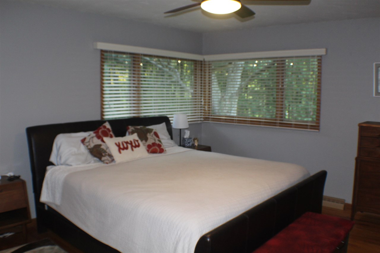 840 Spring Ridge Court Belvidere, IL 61008 - Photo 8 of 25 a bedroom with a bed window and a table