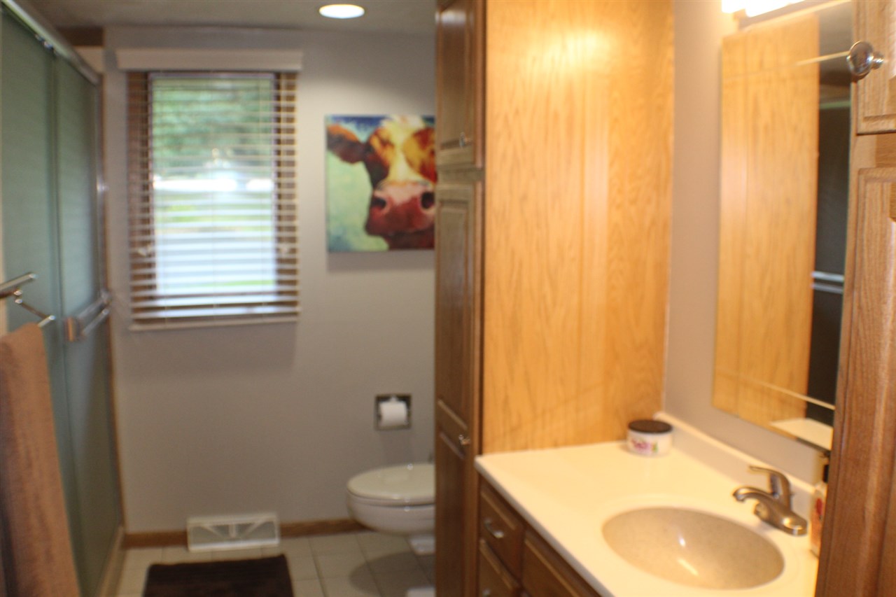 840 Spring Ridge Court Belvidere, IL 61008 - Photo 9 of 25 a bathroom with a granite countertop sink toilet and mirror