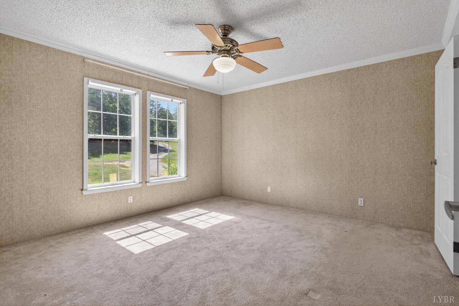 1811 Mohawk Road Gladys, VA 24554 - Photo 7 of 51 an empty room with windows and fan