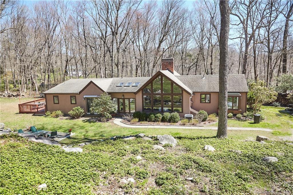 261 Wire Mill Road Stamford, CT 06903 - Photo 1 of 1 a front view of a house with a yard