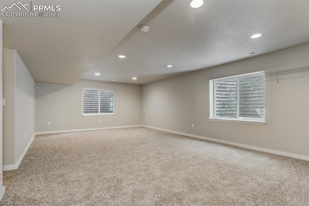 10034 Intrepid Way Colorado Springs, CO 80925 - Photo 19 of 31 a view of an empty room with a window