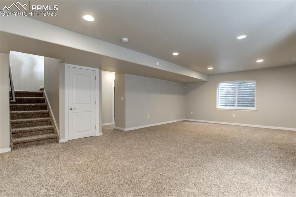 10034 Intrepid Way Colorado Springs, CO 80925 - Photo 20 of 31 an empty room with a exposed radiator and windows