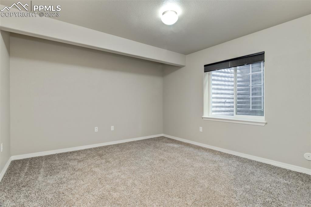 10034 Intrepid Way Colorado Springs, CO 80925 - Photo 22 of 31 an empty room with a window