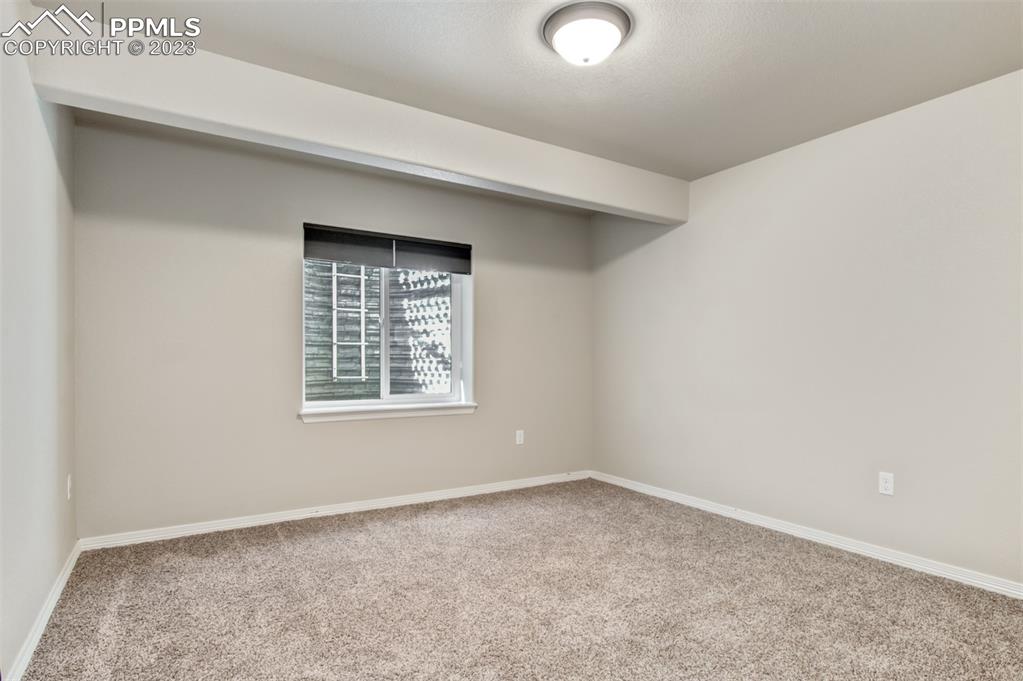 10034 Intrepid Way Colorado Springs, CO 80925 - Photo 25 of 31 an empty room with a window