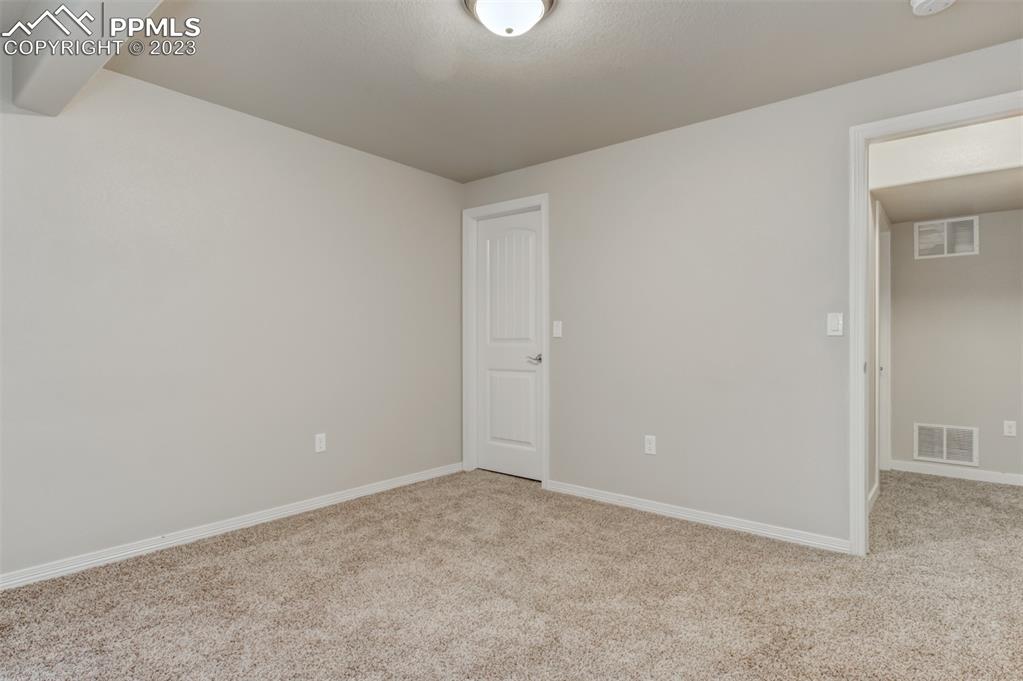 10034 Intrepid Way Colorado Springs, CO 80925 - Photo 26 of 31 a view of an empty room