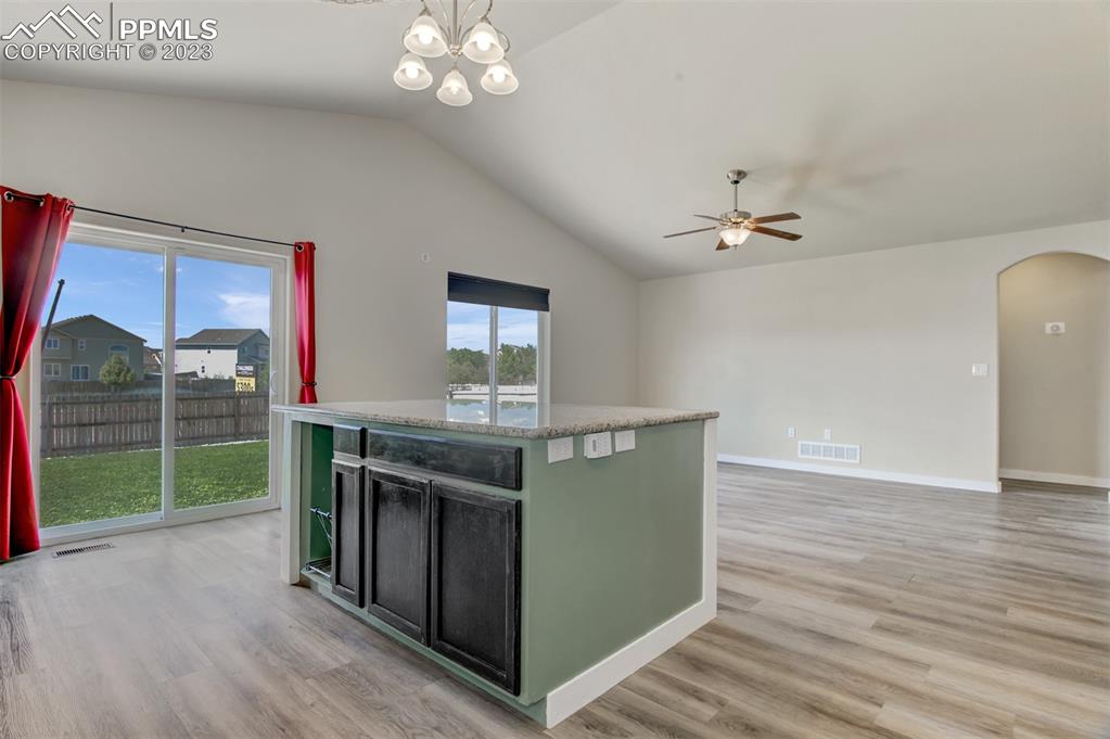 10034 Intrepid Way Colorado Springs, CO 80925 - Photo 7 of 31 a view of kitchen with cabinets and outdoor view