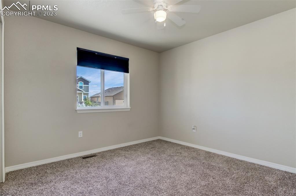 10034 Intrepid Way Colorado Springs, CO 80925 - Photo 10 of 31 an empty room with a window
