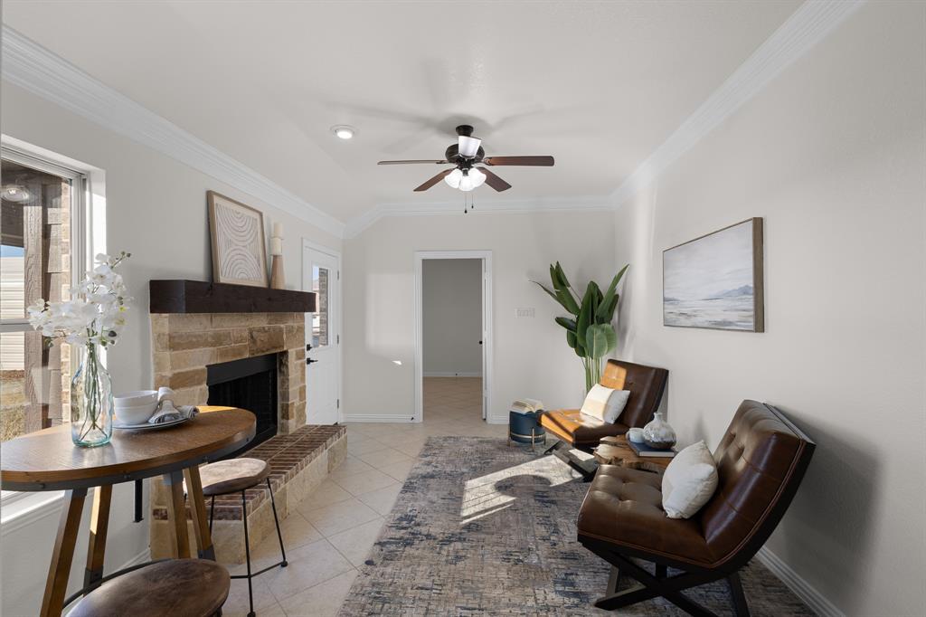 186 County Road 4430 Rhome, TX 76078 - Photo 13 of 40 a living room with furniture fireplace and window