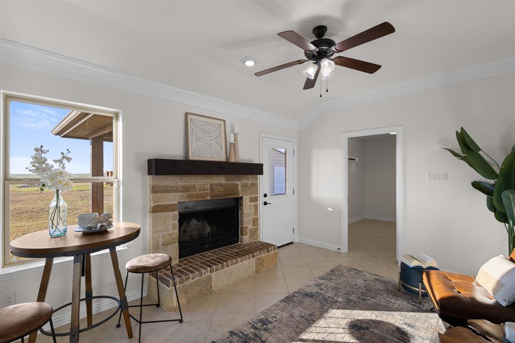186 County Road 4430 Rhome, TX 76078 - Photo 15 of 40 a living room with furniture and a fireplace