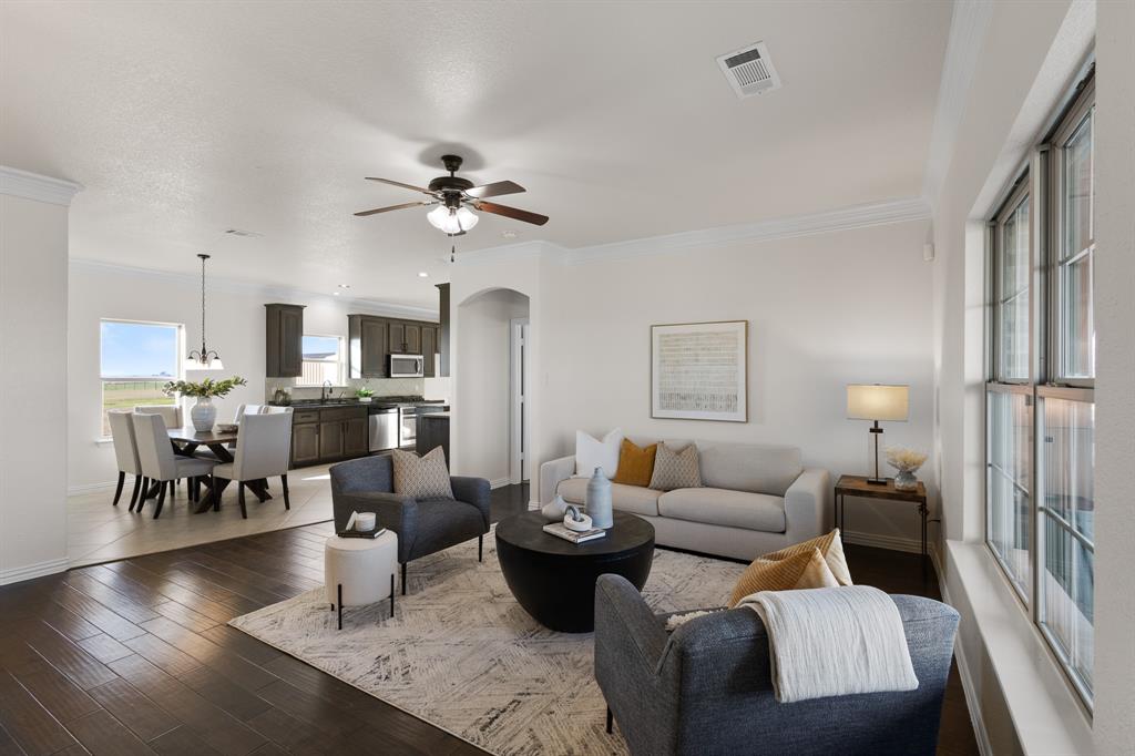 186 County Road 4430 Rhome, TX 76078 - Photo 5 of 40 a living room with lots of furniture and kitchen view