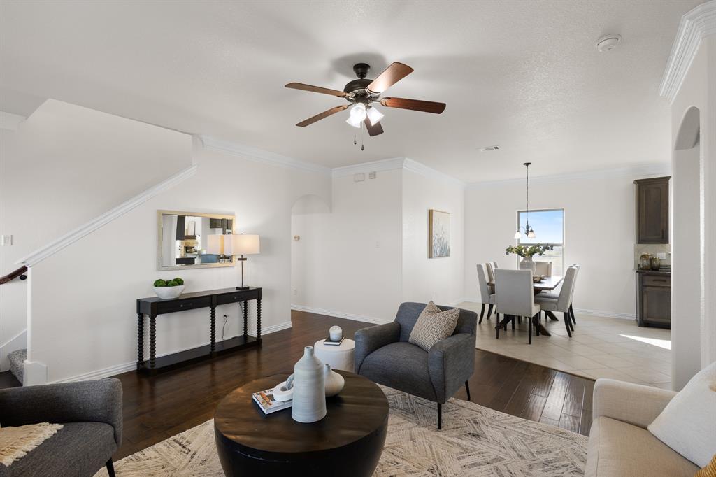 186 County Road 4430 Rhome, TX 76078 - Photo 8 of 40 a living room with furniture and a chandelier