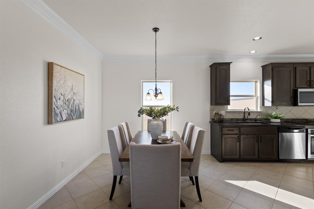 186 County Road 4430 Rhome, TX 76078 - Photo 9 of 40 a dining room with furniture and window