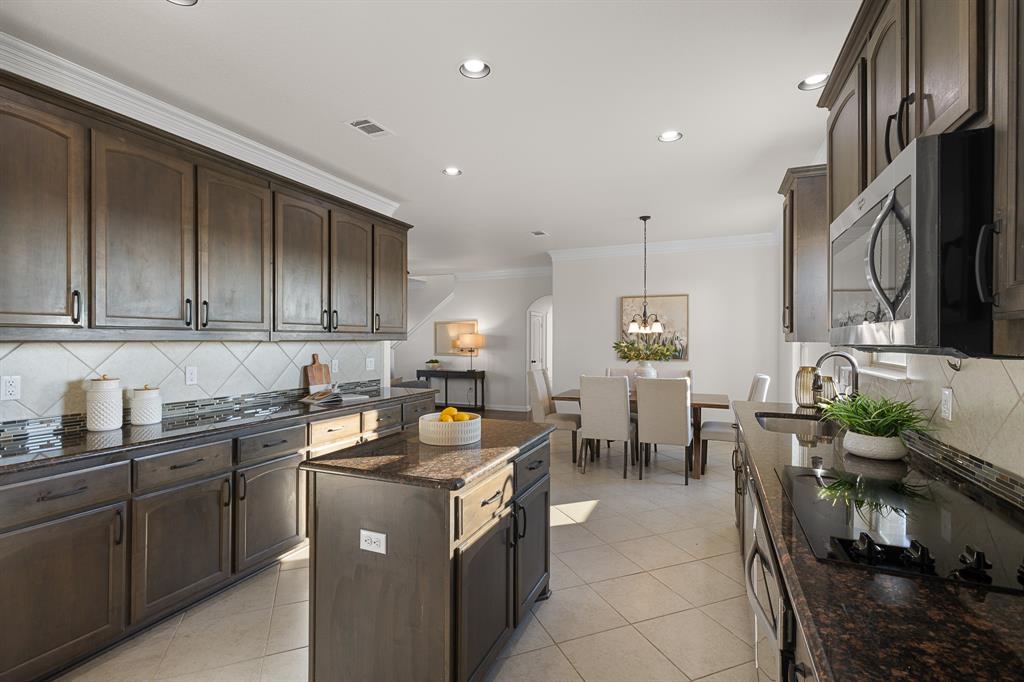 186 County Road 4430 Rhome, TX 76078 - Photo 10 of 40 a kitchen with a sink and cabinets