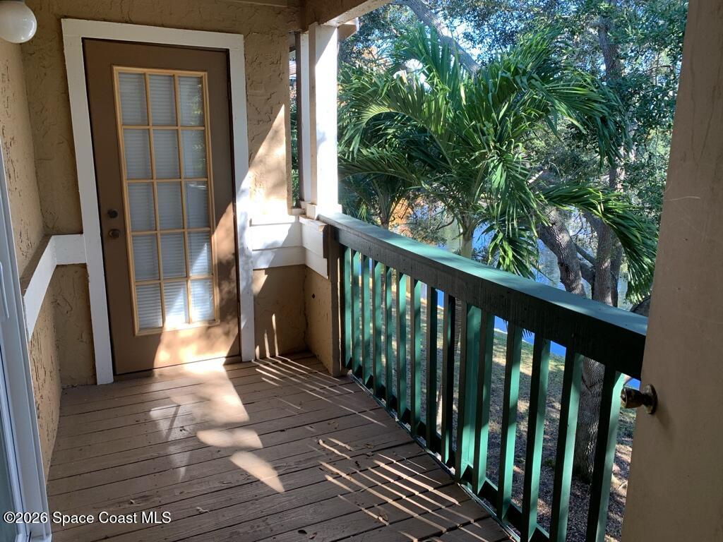 7667 North Wickham Road, Unit 720 Melbourne, FL 32940 - Photo 3 of 28 a view of a balcony with wooden floor