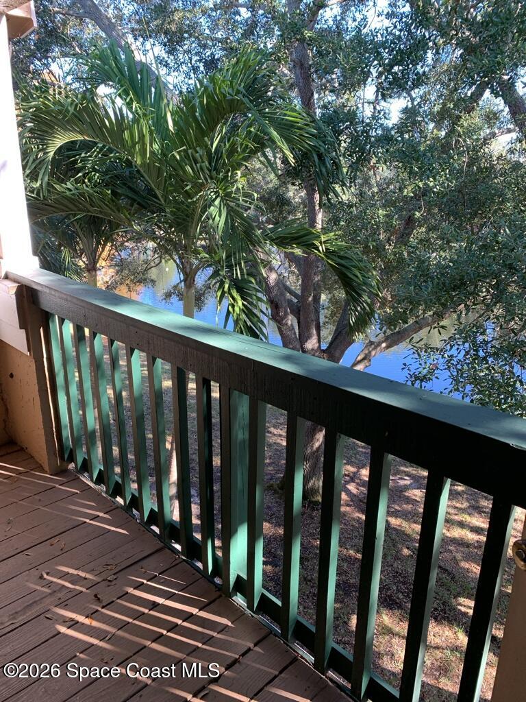 7667 North Wickham Road, Unit 720 Melbourne, FL 32940 - Photo 4 of 28 a view of a balcony with wooden floor
