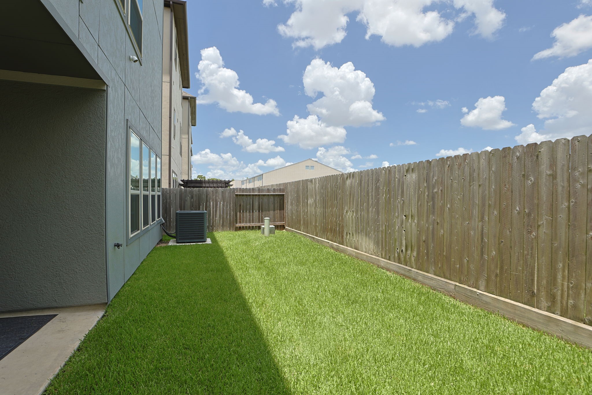4004 Centre Meadow Way Houston, TX 77043 - Photo 30 of 33 Backyard with small patio. The tenant is responsible for this part of the yard.