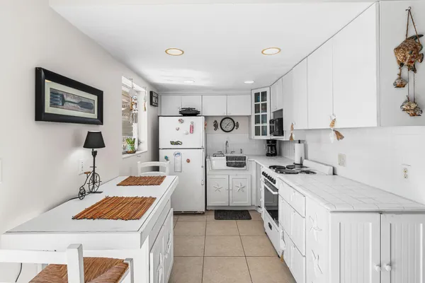 a kitchen that has a cabinets and a stove