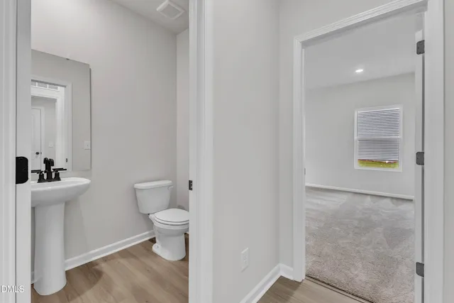 a bathroom with a toilet and a sink