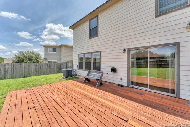 a view of a backyard with sitting area