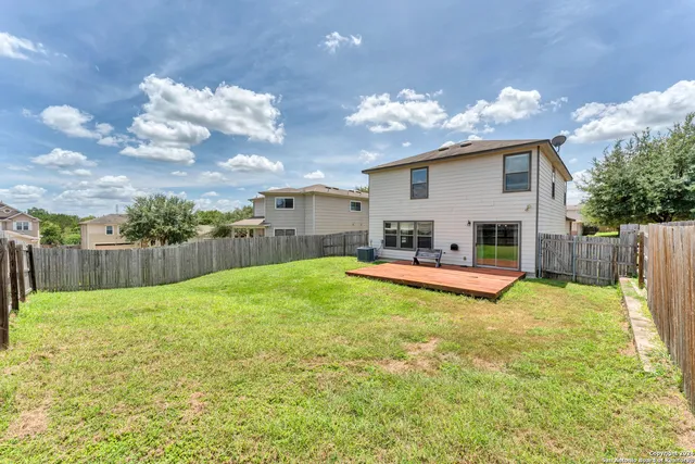 a view of a backyard with a garden and plants