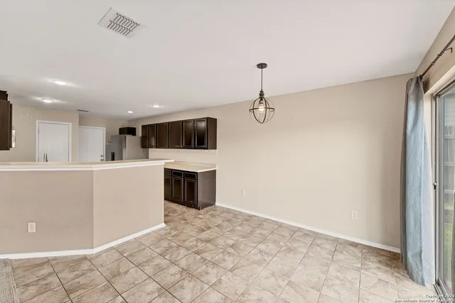 a view of a kitchen with a sink and a stove top oven