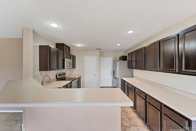 a large kitchen with a large counter top