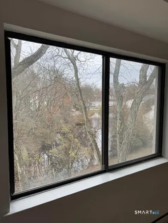 a view of a large window with an outdoor space