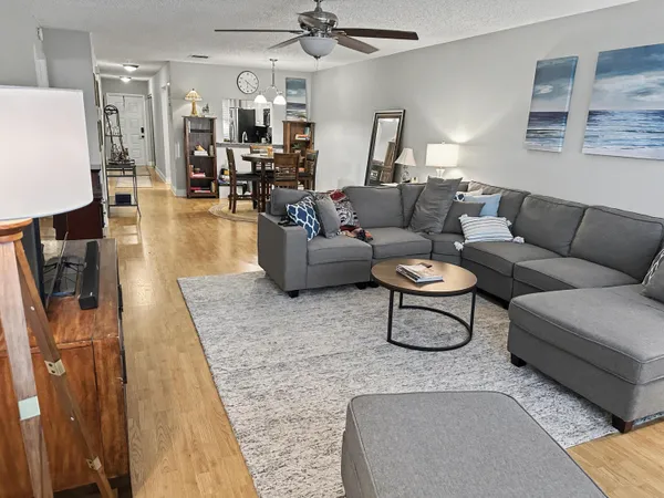 a living room with furniture and a rug