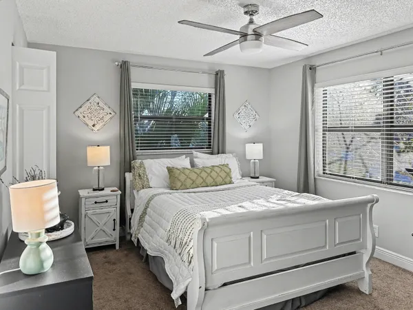 a bedroom with a bed and a table in it