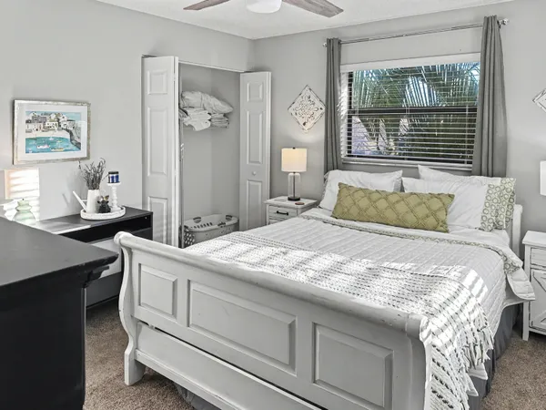 a bedroom with a bed and a table
