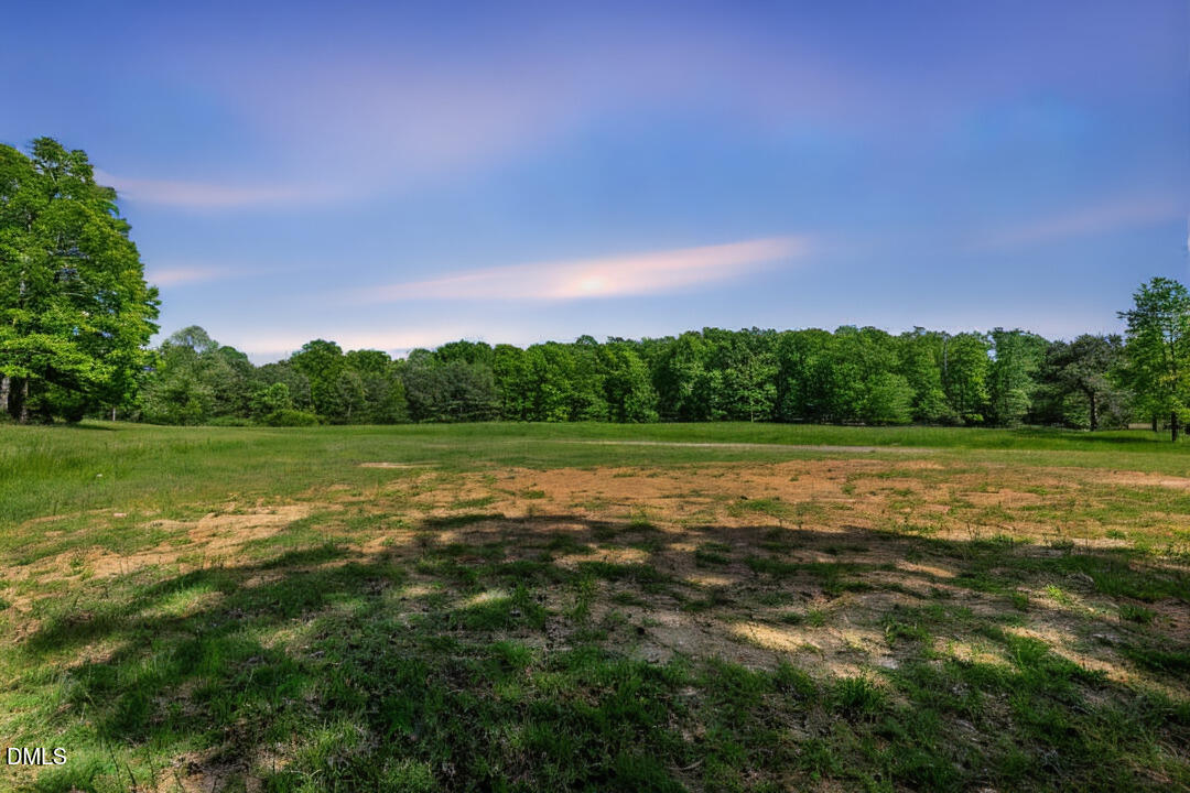 a view of lake with green space