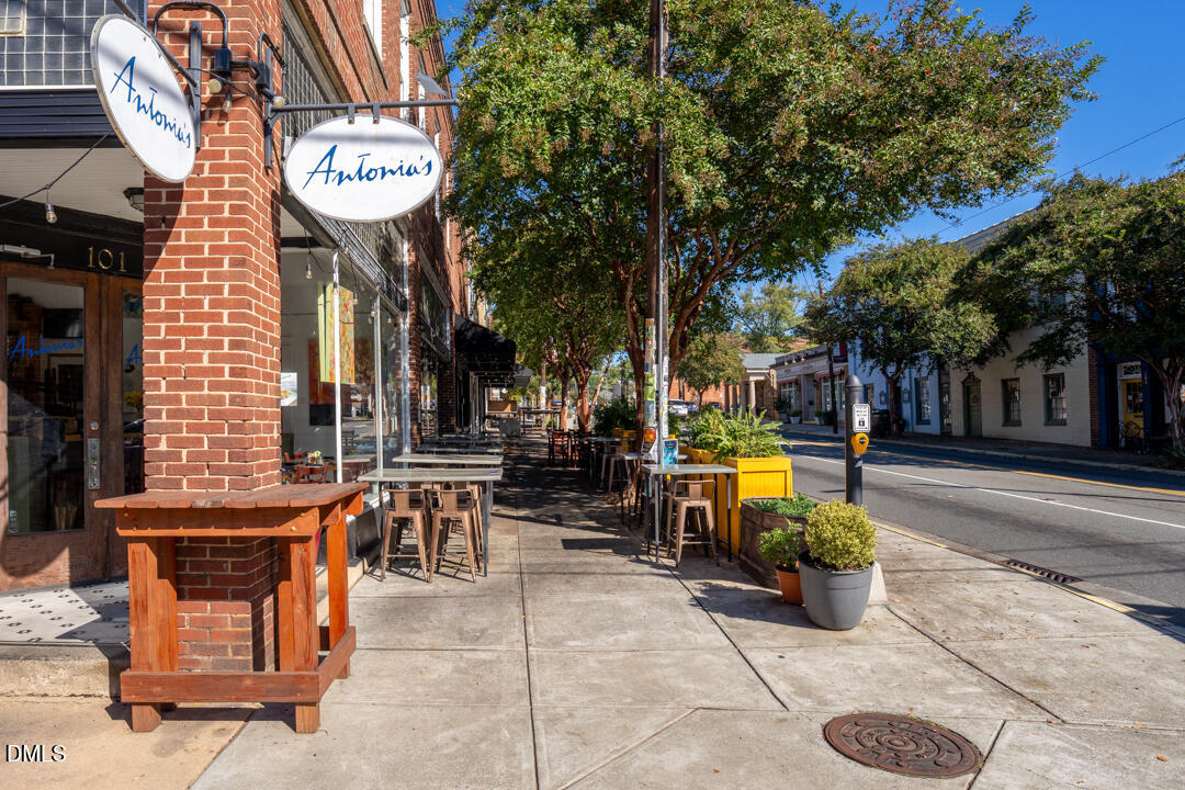 2853 Franklin Road Hillsborough, NC 27278 - Photo 15 of 18 a view of a building with sitting area and garden