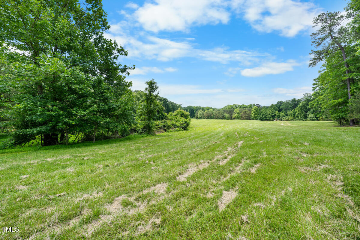 2853 Franklin Road Hillsborough, NC 27278 - Photo 6 of 18 a view of a green field with wooden fence