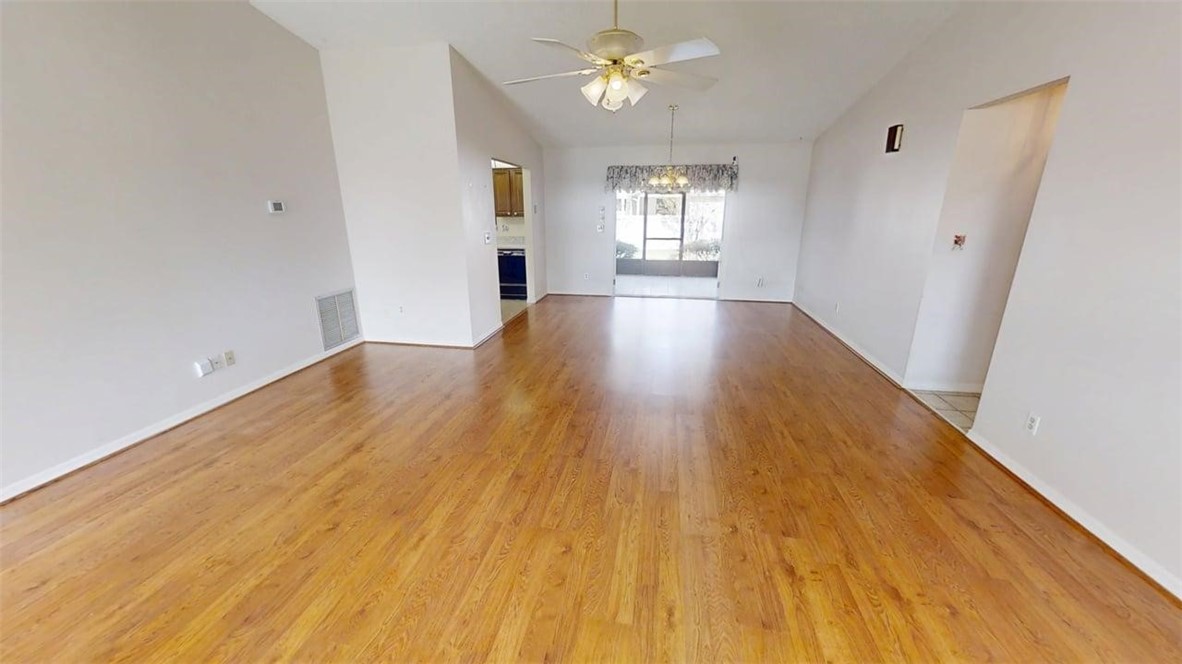 137 Concha Drive Sebastian, FL 32958 - Photo 5 of 21 wooden floor in an empty room with a window