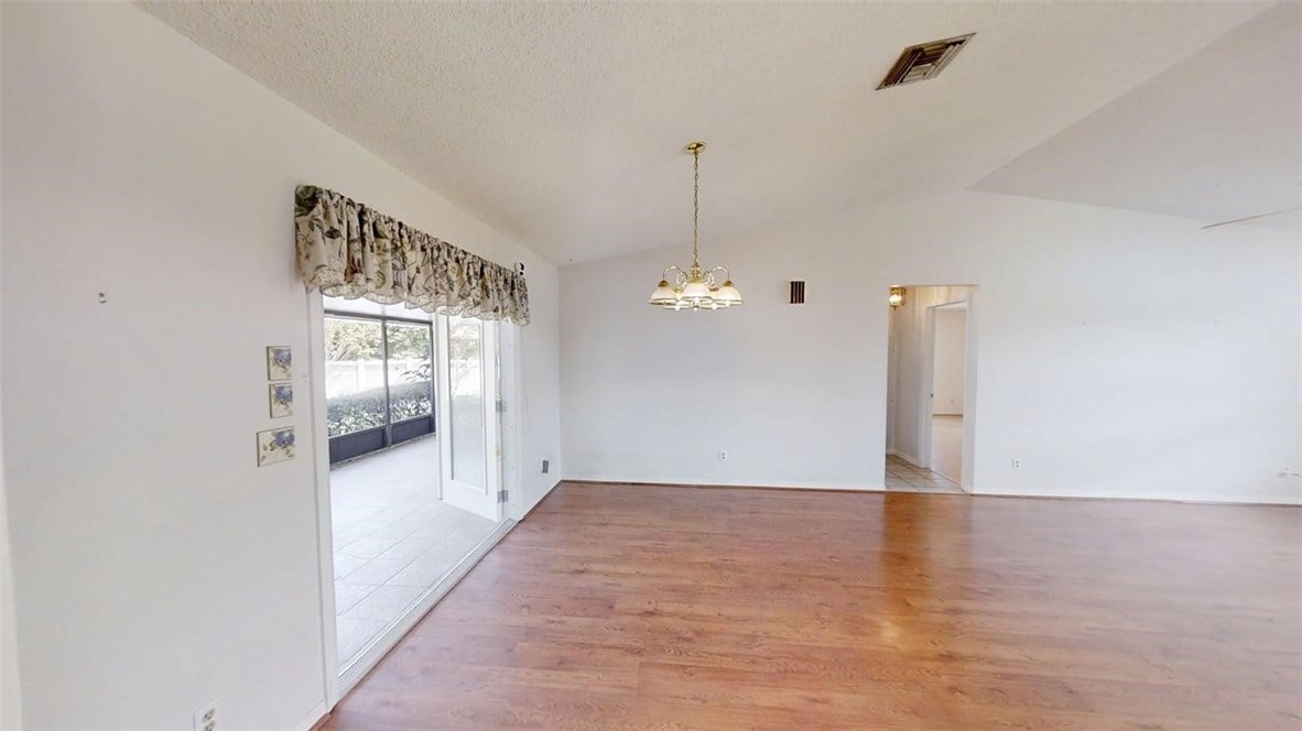 137 Concha Drive Sebastian, FL 32958 - Photo 8 of 21 a view of a hallway with wooden floor