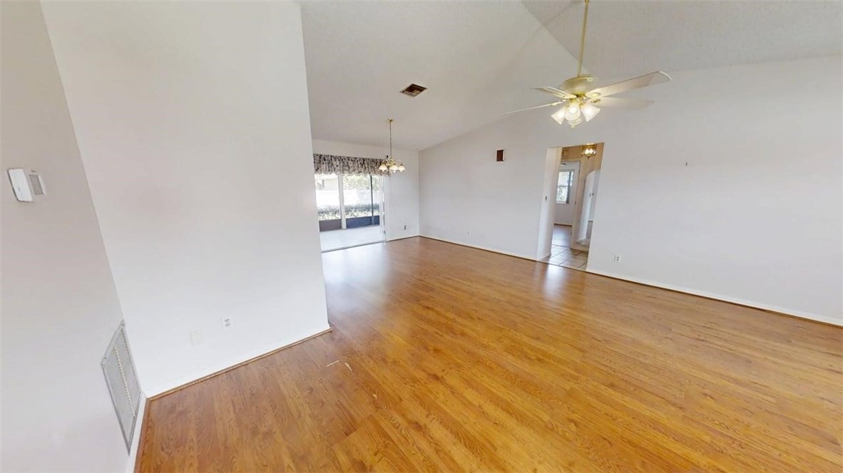 137 Concha Drive Sebastian, FL 32958 - Photo 9 of 21 a view of an empty room with wooden floor