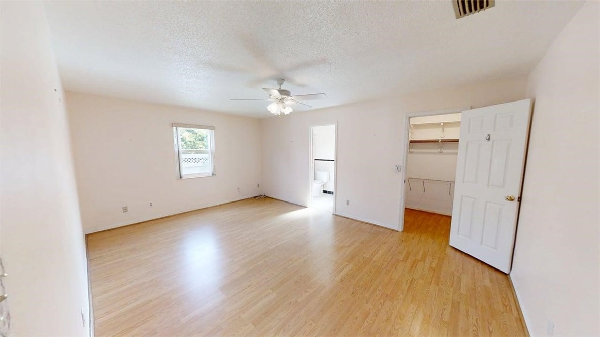 137 Concha Drive Sebastian, FL 32958 - Photo 10 of 21 an empty room with wooden floor and windows