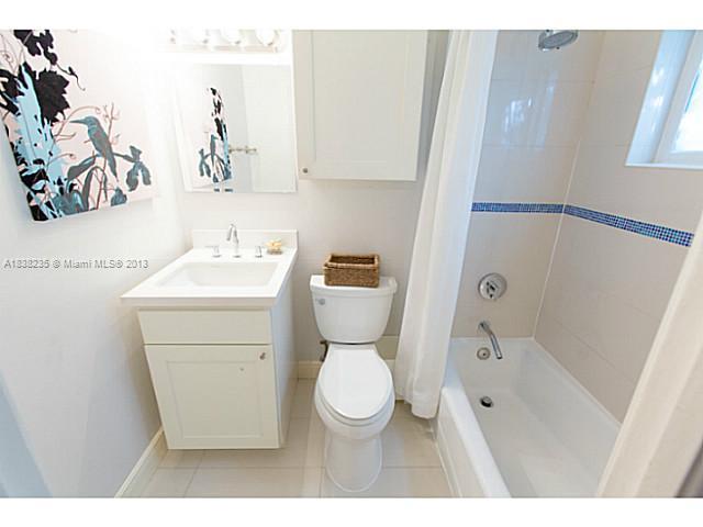 5767 Southwest 35th Street Miami, FL 33155 - Photo 13 of 18 a bathroom with a toilet sink and shower
