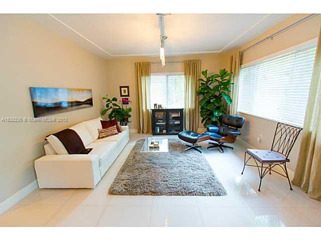 5767 Southwest 35th Street Miami, FL 33155 - Photo 3 of 18 a living room with furniture and a large window