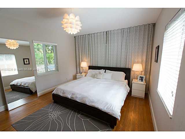 5767 Southwest 35th Street Miami, FL 33155 - Photo 10 of 18 a bedroom with a bed and a window