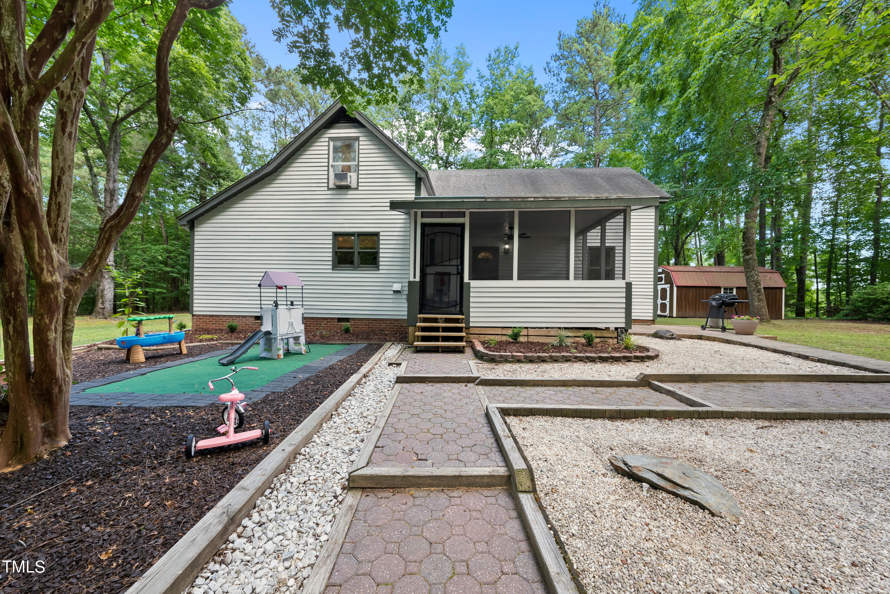 6319 Carbonton Road Sanford, NC 27330 - Photo 15 of 19 a front view of a house with garden