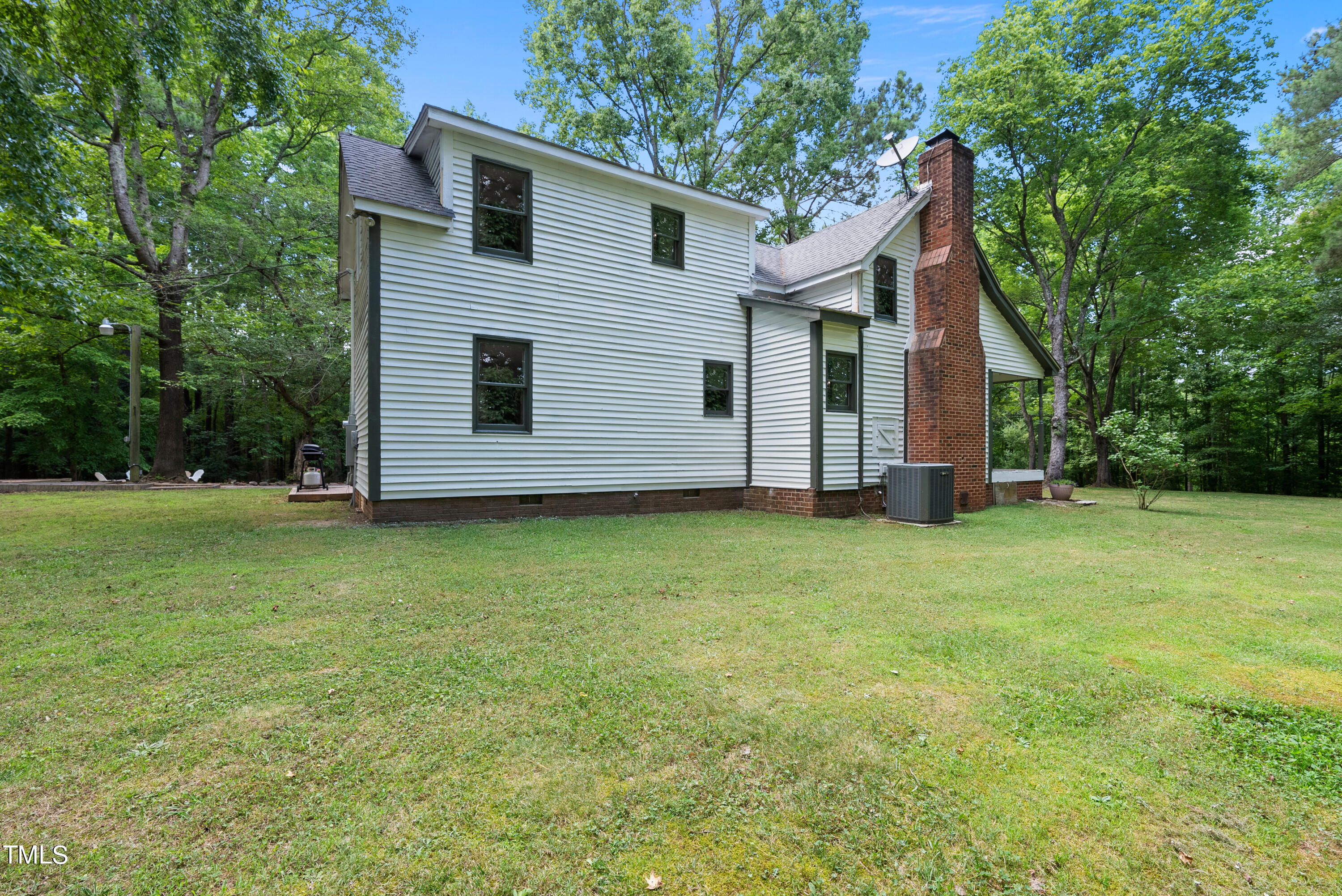 6319 Carbonton Road Sanford, NC 27330 - Photo 16 of 19 a view of backyard of house with wooden fence