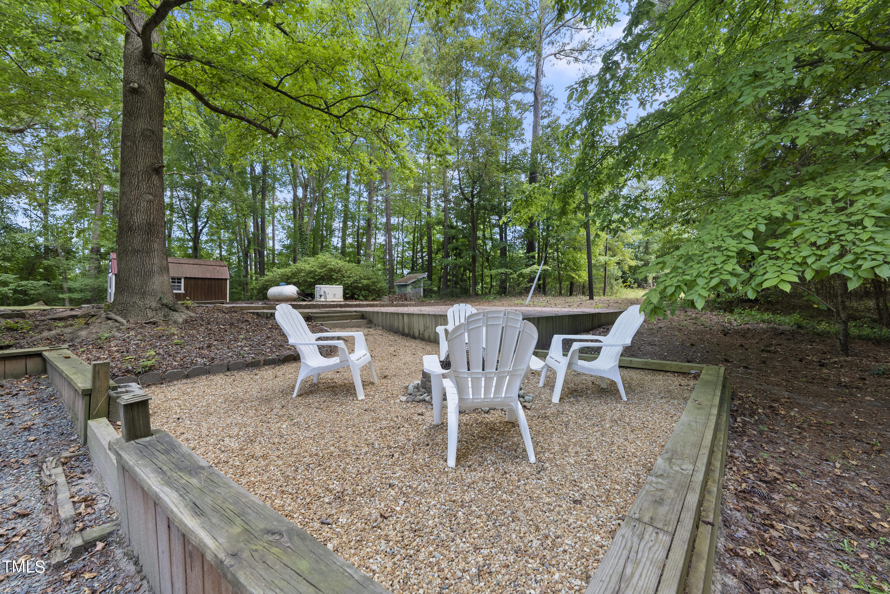 6319 Carbonton Road Sanford, NC 27330 - Photo 17 of 19 a view of a chairs and table in backyard