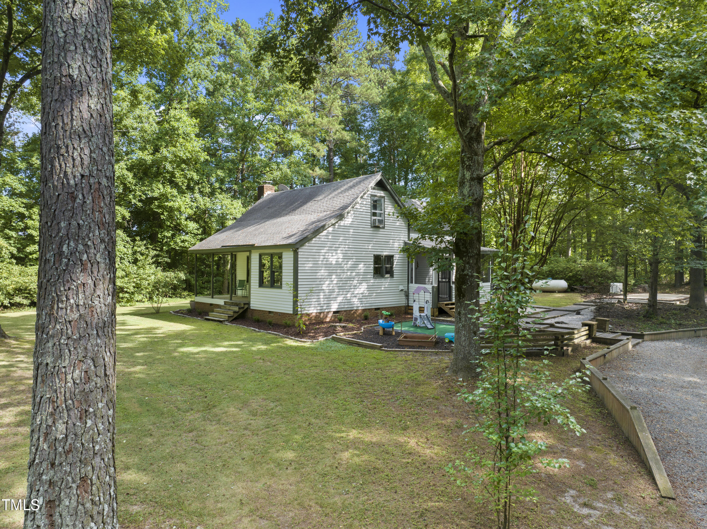 6319 Carbonton Road Sanford, NC 27330 - Photo 3 of 19 a view of house with outdoor entertaining space