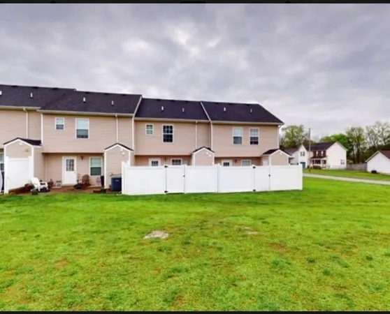 a view of a house with a big yard