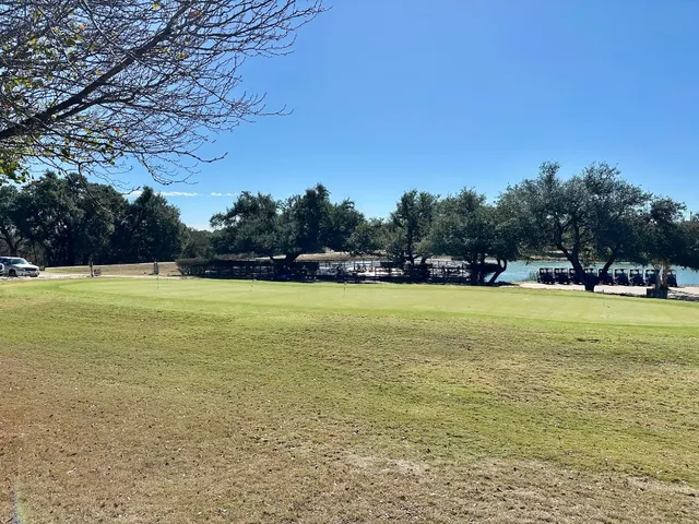 a view of outdoor space with swimming pool and green space