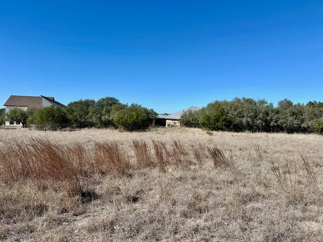 a view of a backyard of the house